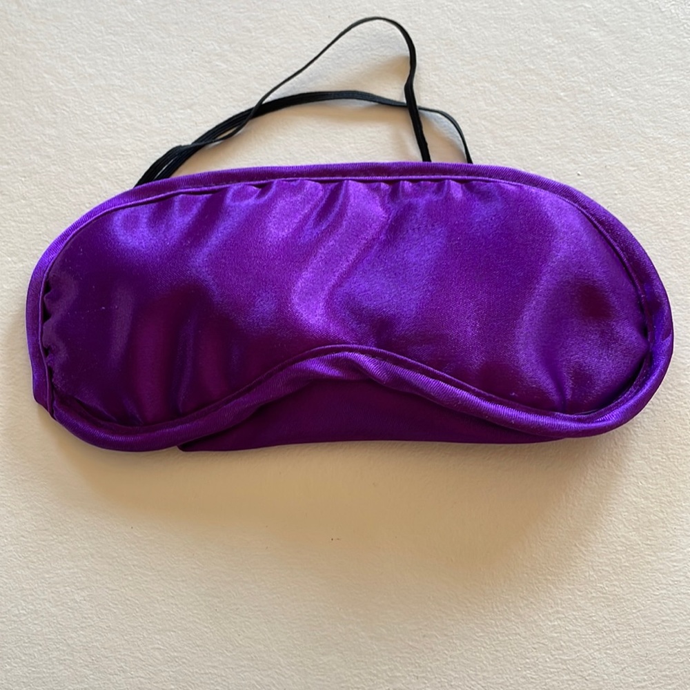 Purple satin sleep mask.  $15/ FREE with Purchase
